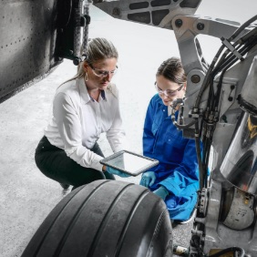 two engineers working on an aircraft